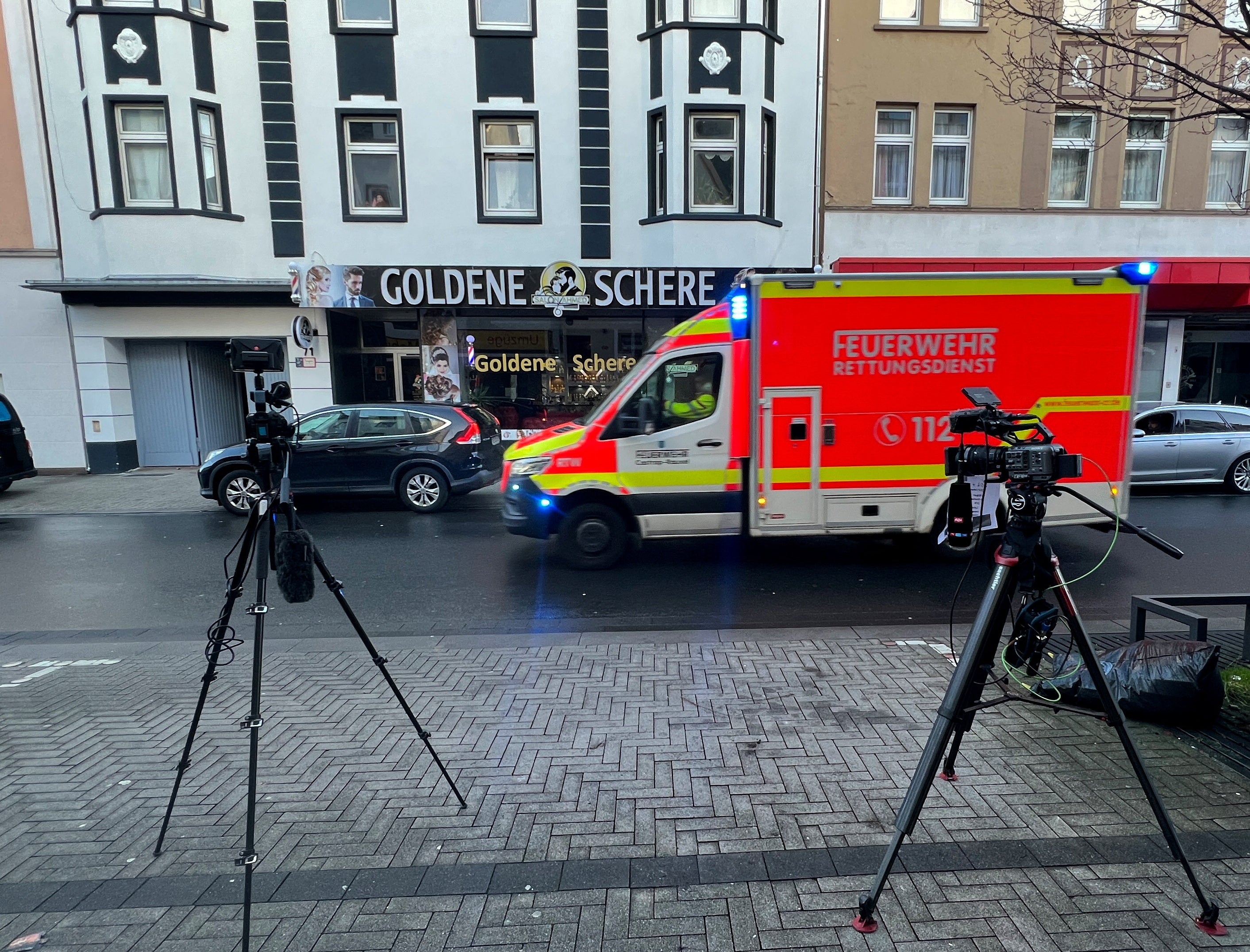 TV cameras are set up in front of a building where German police have taken a 32-year-old Iranian citizen into custody