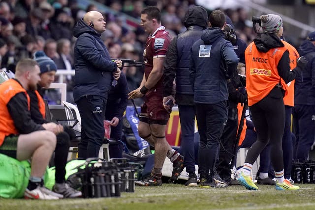 Sale Sharks’ Tom Curry (centre) is replaced during the win over Harlequins after an injury to his right leg (Andrew Matthews/PA Images).