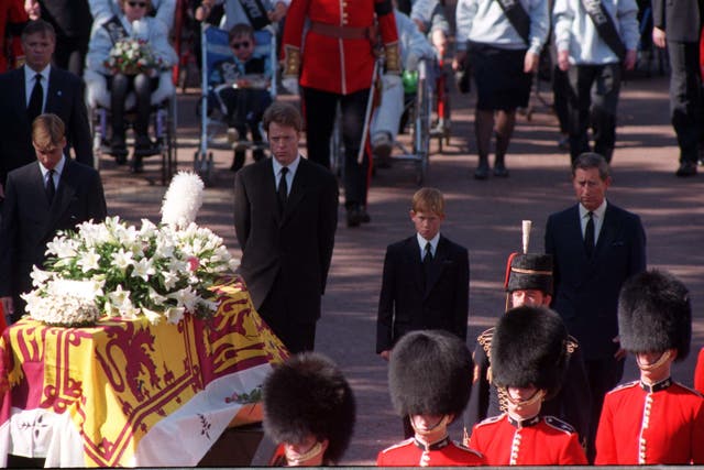 Princes William and Harry, the sons of Diana, Princess of Wales, her brother Earl Spencer and her former husband, the Prince of Wales, walking behind her coffin as the funeral procession approaches Westminster Abbey (Adam Butler/PA)