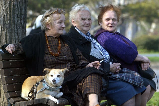 <p>Three elderly women with a pet rest on a bank in a park in central Belgrade, 07 April 2005 as they take advantage of nice weather over the region</p>