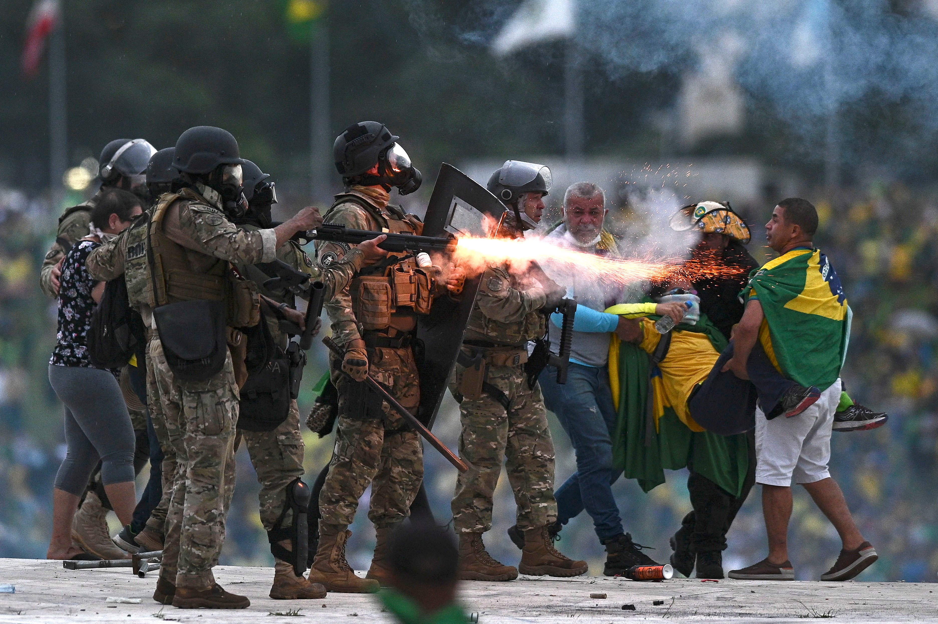 Police confront Bolsonaro supporters during the clashes