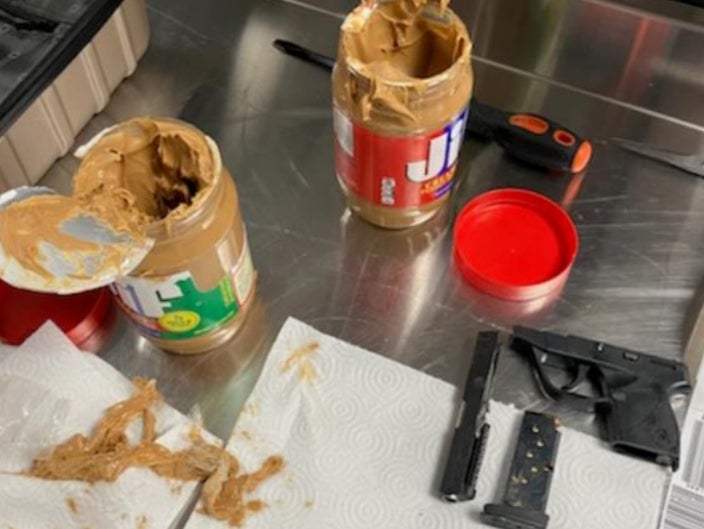 The sections of handgun were concealed in two peanut butter jars