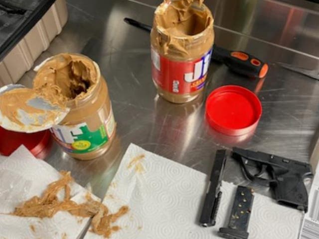 <p>The sections of handgun were concealed in two peanut butter jars</p>