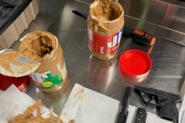 <p>The sections of handgun were concealed in two peanut butter jars</p>