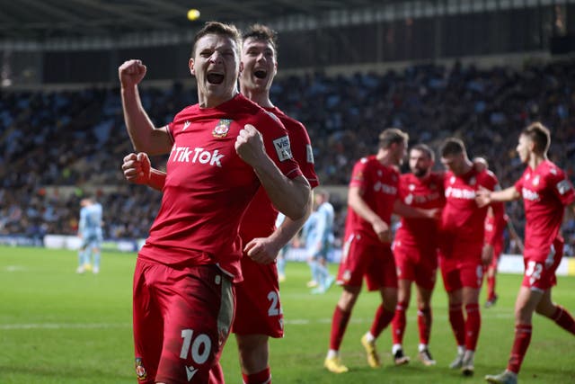 <p>Wrexham’s Thomas O’Connor celebrates during their dramatic win over Coventry City </p>