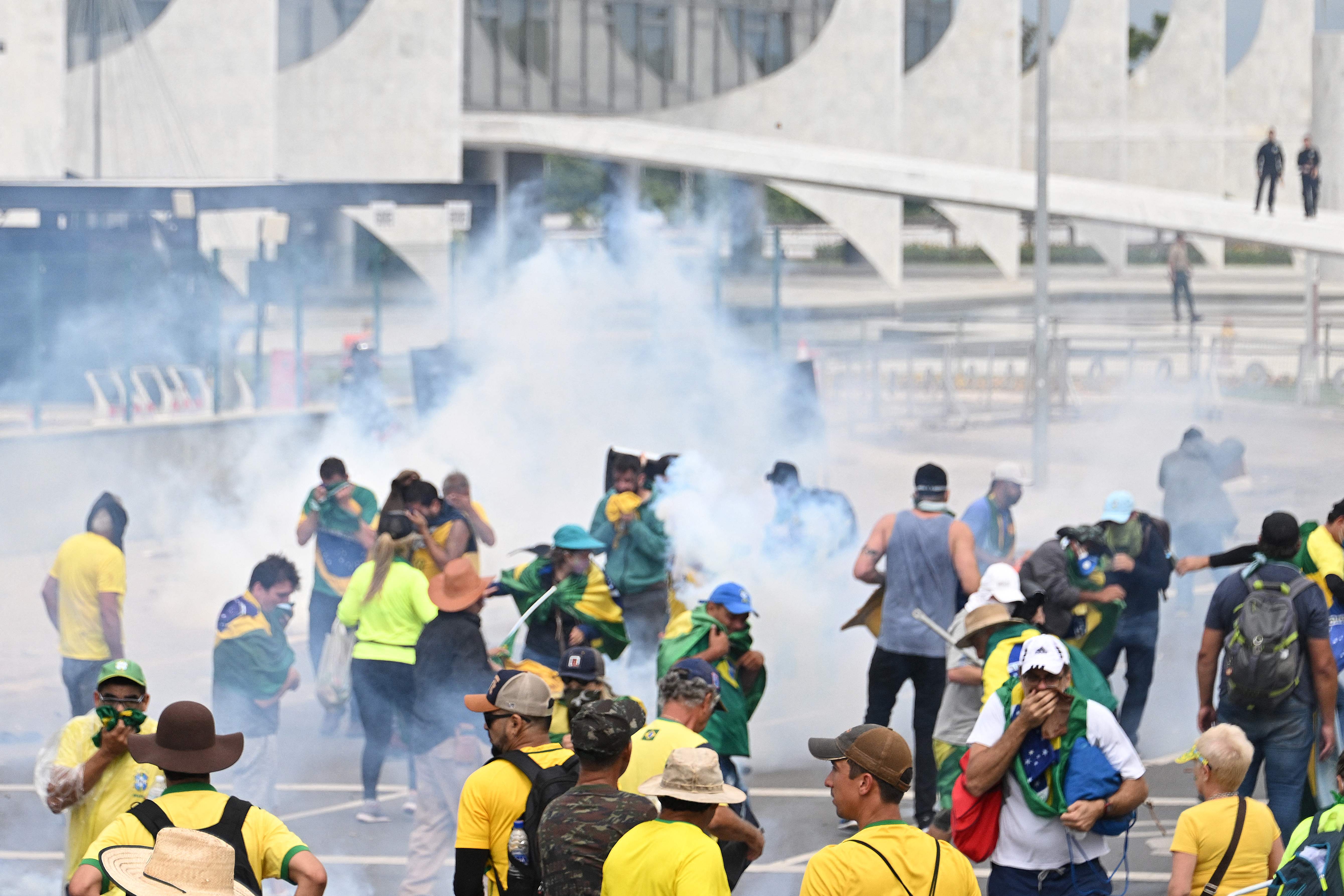 Supporters of Brazilian former President Jair Bolsonaro clash with the police on Sunday