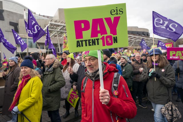 Members of EIS join teachers at a rally outside the Scottish Parliament in Edinburgh (Jane Barlow/PA)