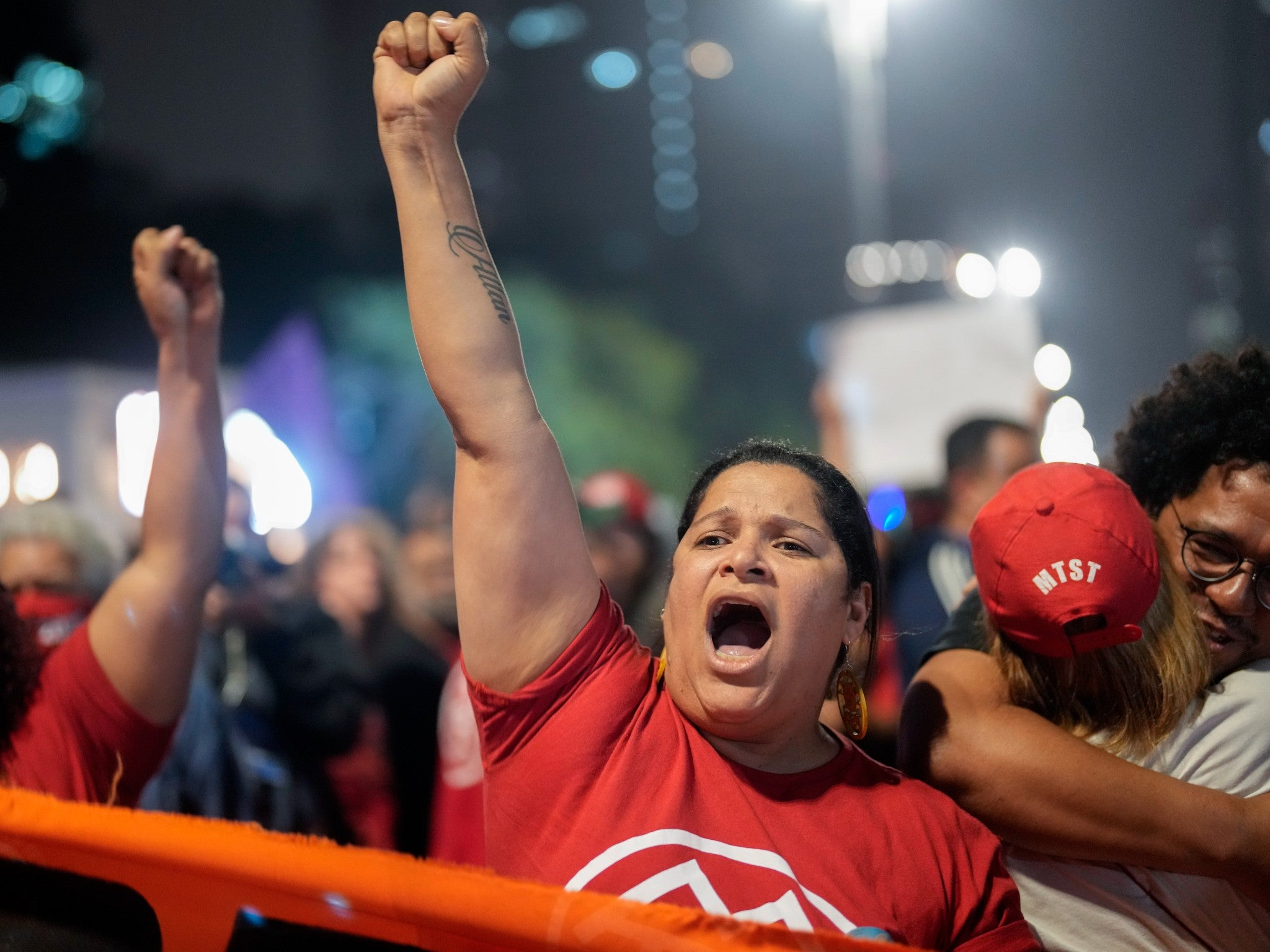 Demonstrators shout slogans against Brazilian former President Jair Bolsonaro during a protest calling for protection of the nation’s democracy in Sao Paulo