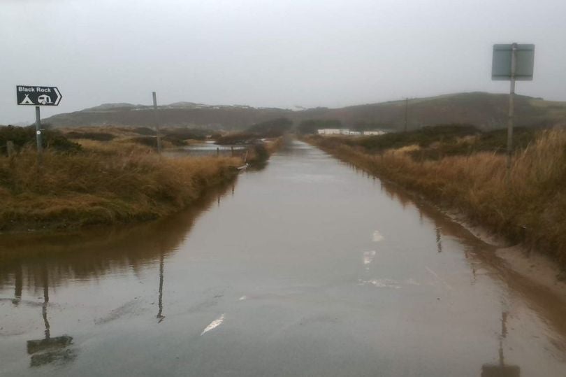Flooding has closed the roads at Morfa Bychan, a popular beach in Gwynedd, North Wales