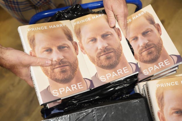 Staff unwrap a box containing copies of the newly released autobiography from the Duke of Sussex (James Manning/PA)