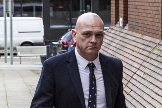 <p>Police officer Paul Hinchcliffe arriving at Leeds Crown Court </p>
