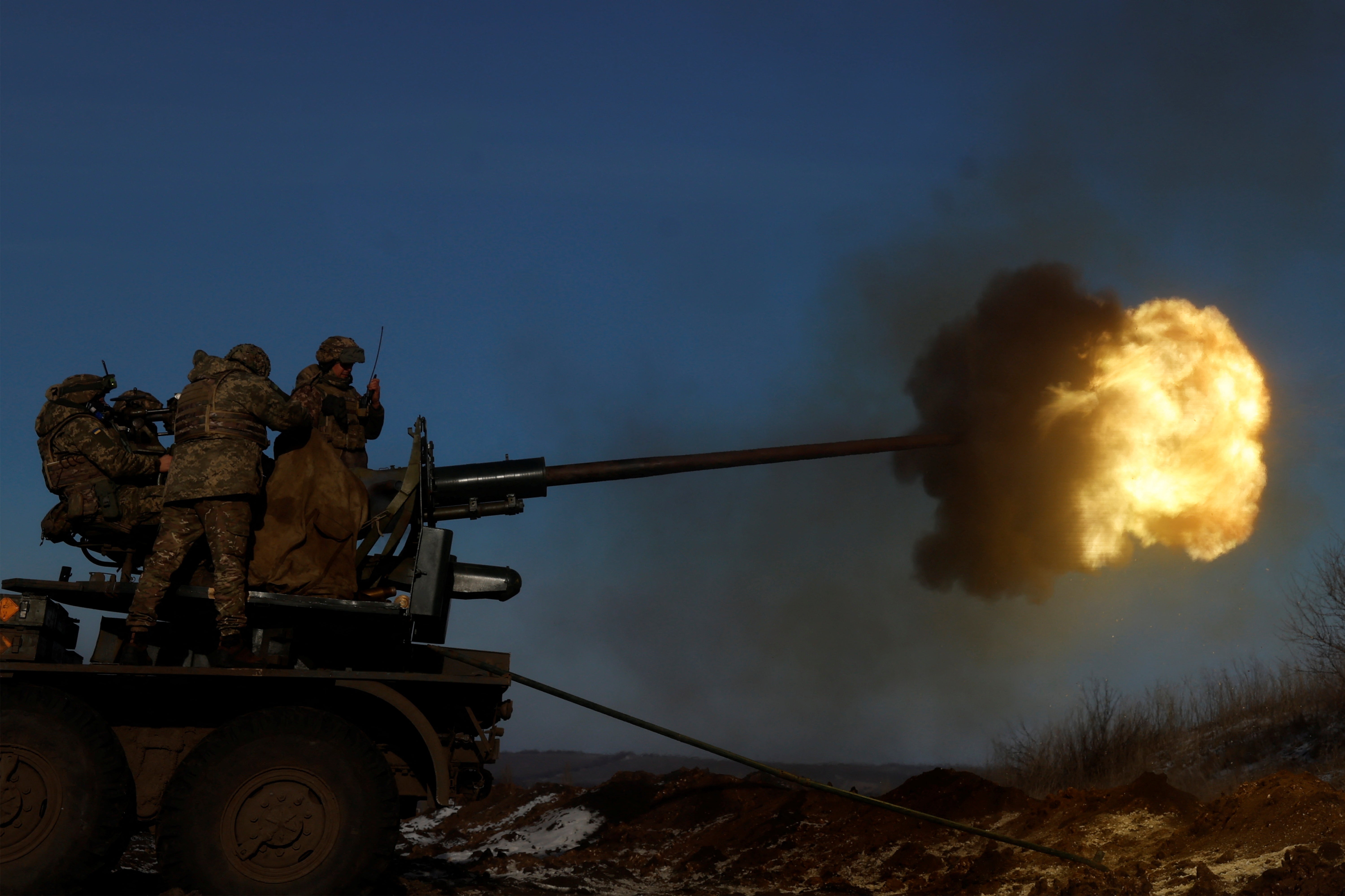 Ukrainian forces fire an anti-aircraft weapon, as fighting continues in the frontline city of Bakhmut