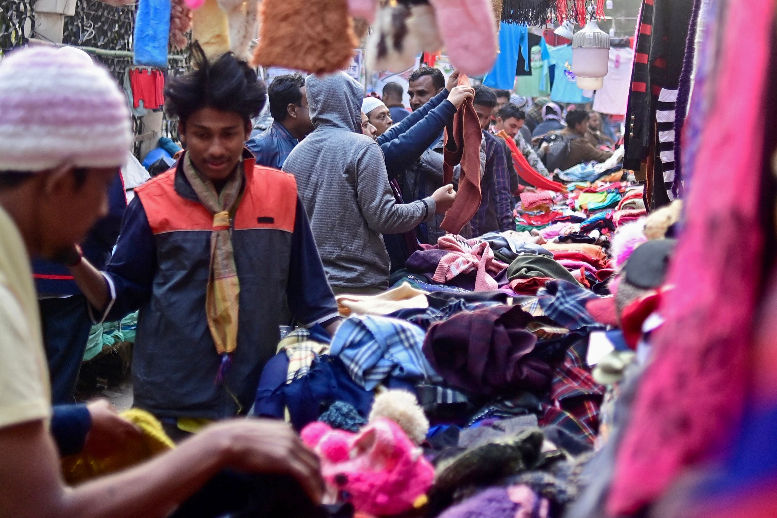 Shoppers crowd a clothes market in Dhaka last week
