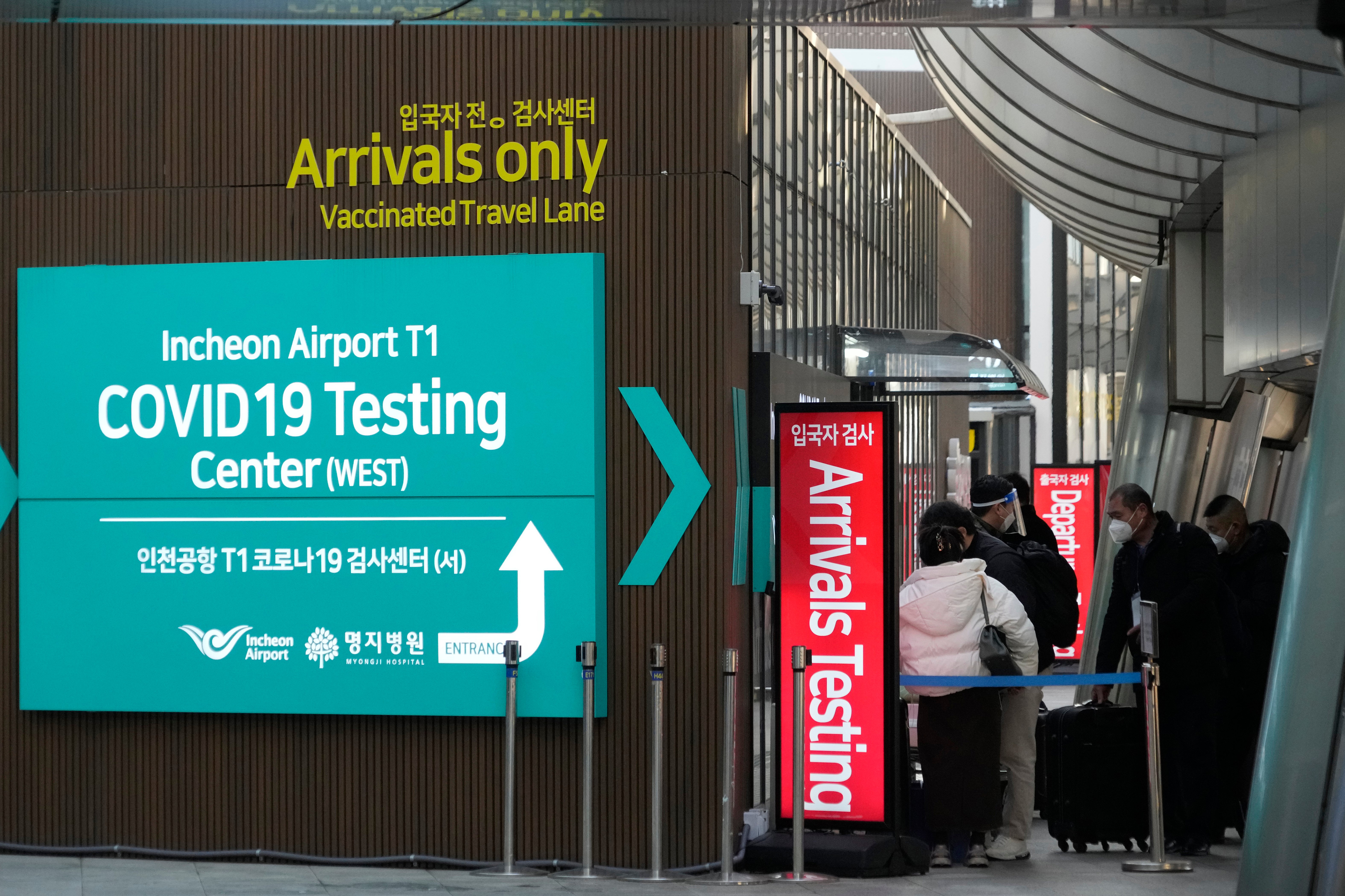 Passengers arriving from China enters a Covid-19 testing centre at the Incheon International Airport in Incheon, South Korea