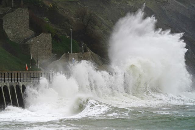 Waves crash over the promenade during rain and strong winds in Folkestone, Kent. The Met Office has issued warnings for heavy rains and floods, falling heaviest in western areas but causing wet and windy conditions all over the country. Picture date: Tuesday January 10, 2023.