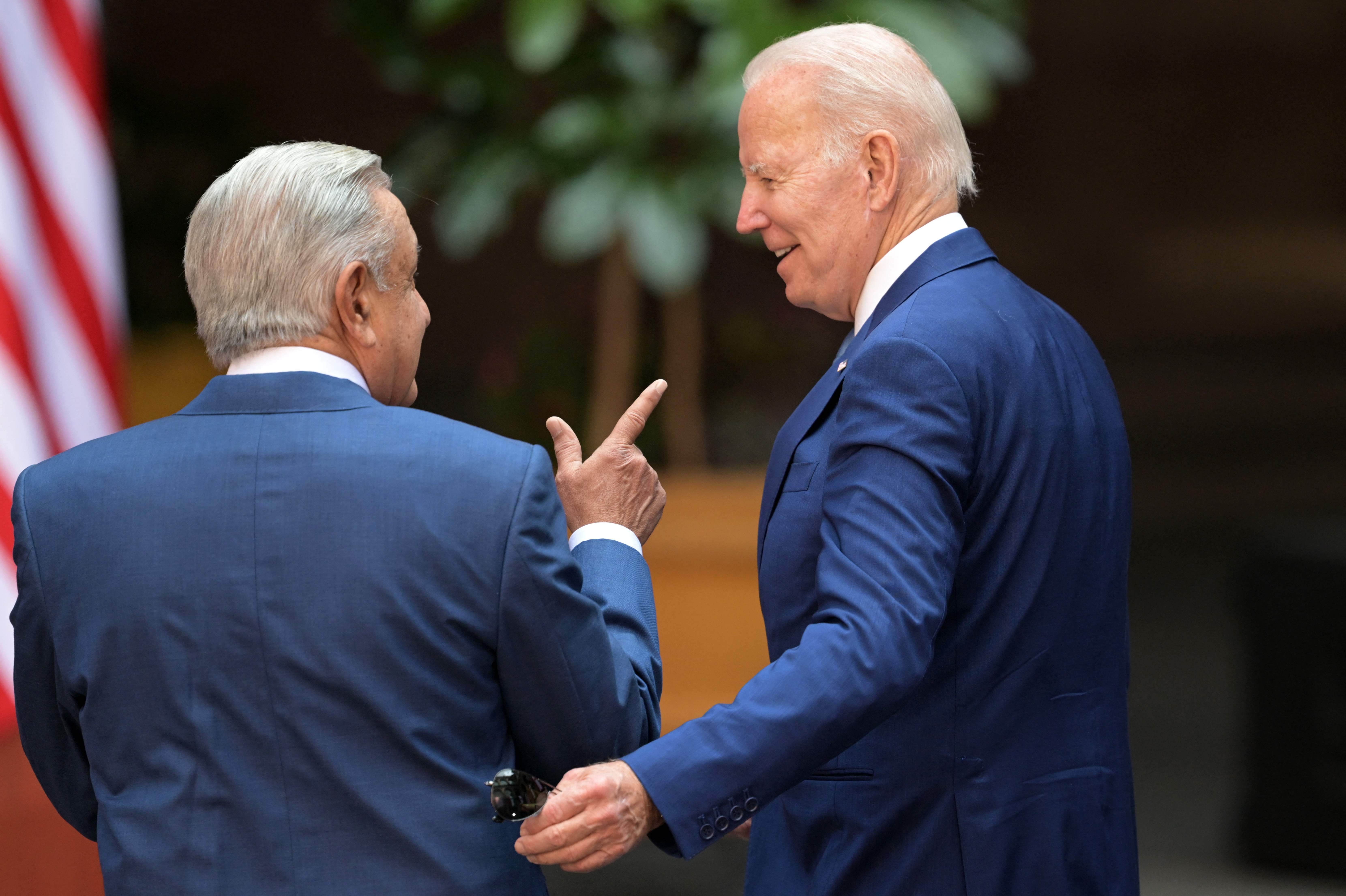 <p>Mexico's President Andres Manuel Lopez Obrador (L) speaks with US President Joe Biden on arrival at the National Palace in Mexico City, on January 10, 2023, during the 10th North American Leaders Summit</p>