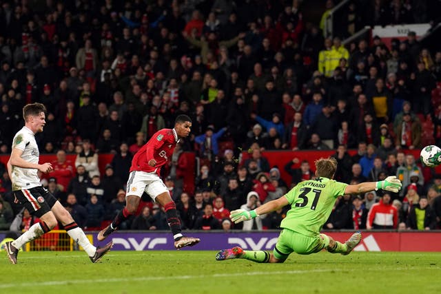 Manchester United’s Marcus Rashford scores (Martin Rickett/PA)