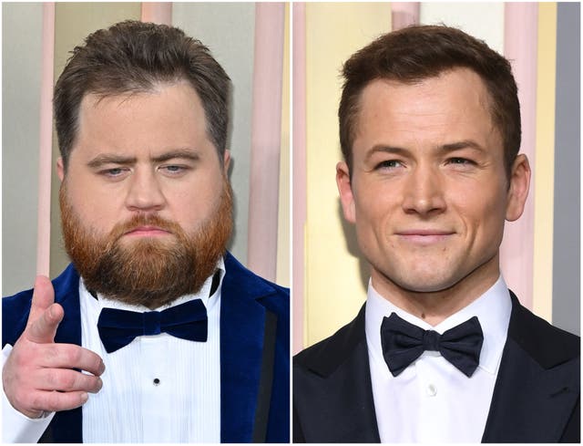 <p>Paul Walter Hauser (left) and Taron Egerton</p>