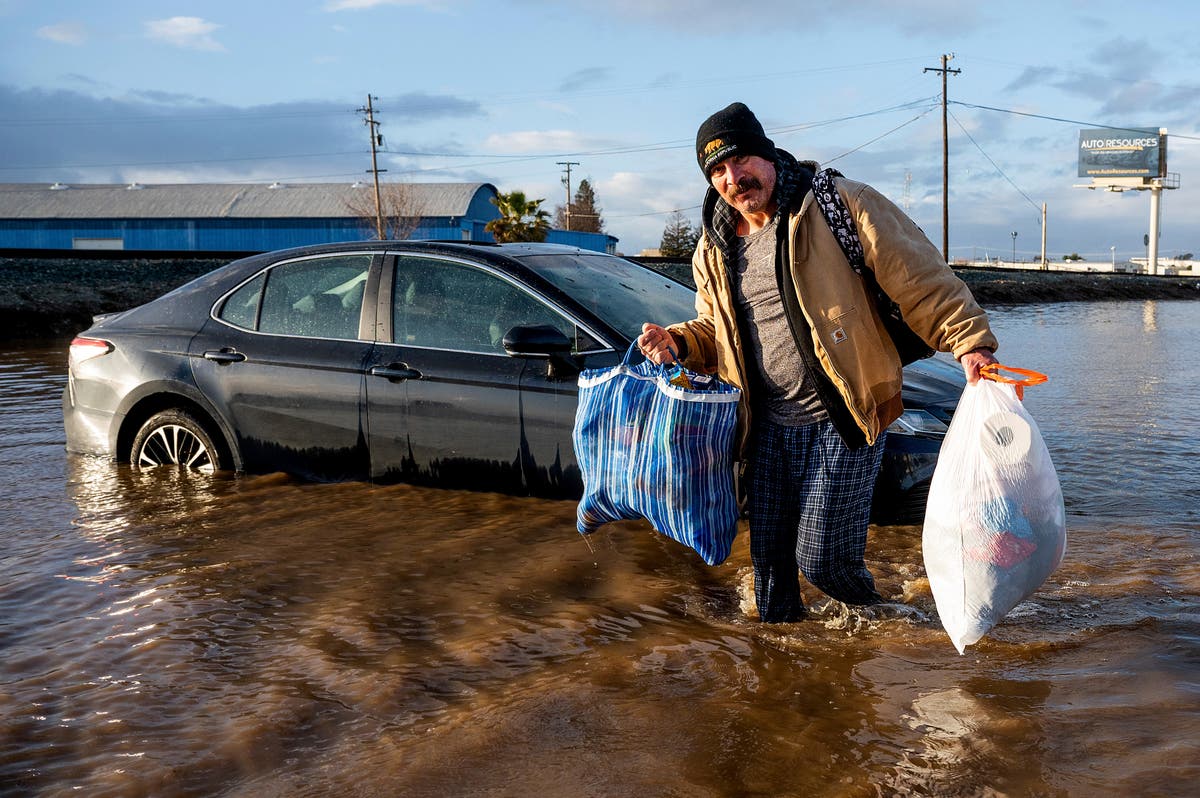 Storm struck California scrambles to clean up ahead of rain