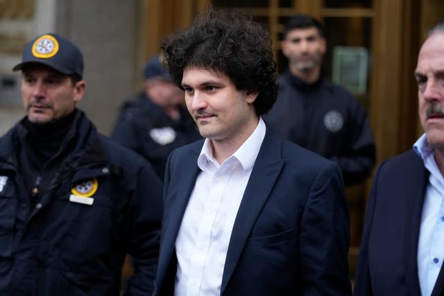 Samuel Bankman-Fried leaves Manhattan federal court in New York, Tuesday, Jan. 3, 2023. Bankman-Fried pleaded not guilty to charges that he cheated investors and looted customer deposits on his cryptocurrency trading platform as a judge set a tentative trial date for October (Seth Wenig/AP/PA)