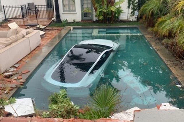 <p>Photo shared by Pasadena Fire Department shows the Tesla submerged in the pool</p>