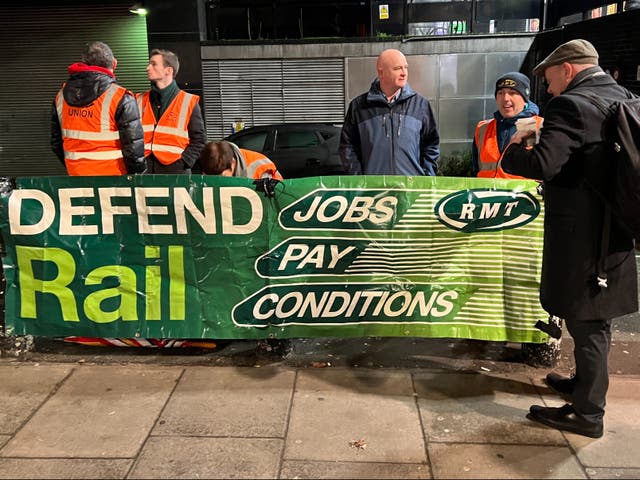 <p>Looking ahead: Mick Lynch (centre), general secretary of the RMT union, on the picket line at Euston at the start of the January 2023 strikes</p>