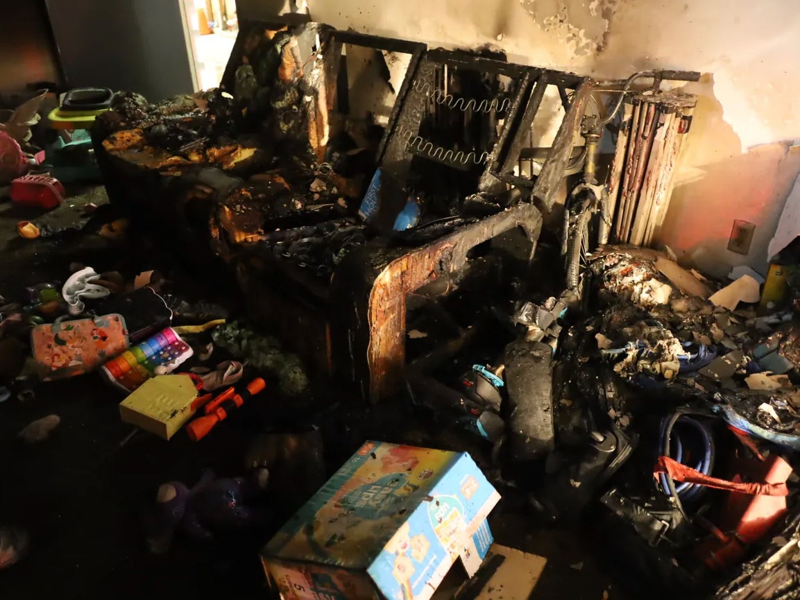 The charred remains of an apartment in Indianapolis, Indiana, that caught fire and left and adult and five children suffering from cardiac arrest. The blaze reportedly began on the couch and spread throughout the unit