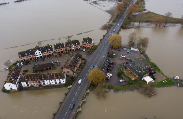 <p>King Johns Court housing estate, Tewkesbury, Gloucestershire, is surrounded by flood water</p>