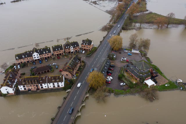 <p>King Johns Court housing estate, Tewkesbury, Gloucestershire, is surrounded by flood water</p>