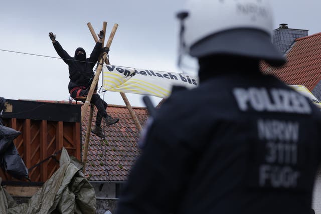<p>Riot police confront activists in Luetzerath next to the Garzweiler coal mine </p>