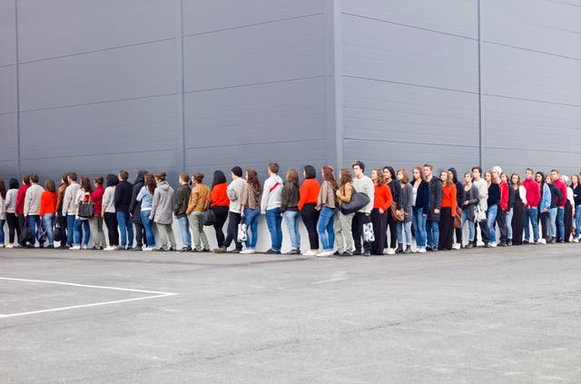 <p>Large group of people waiting in line</p>