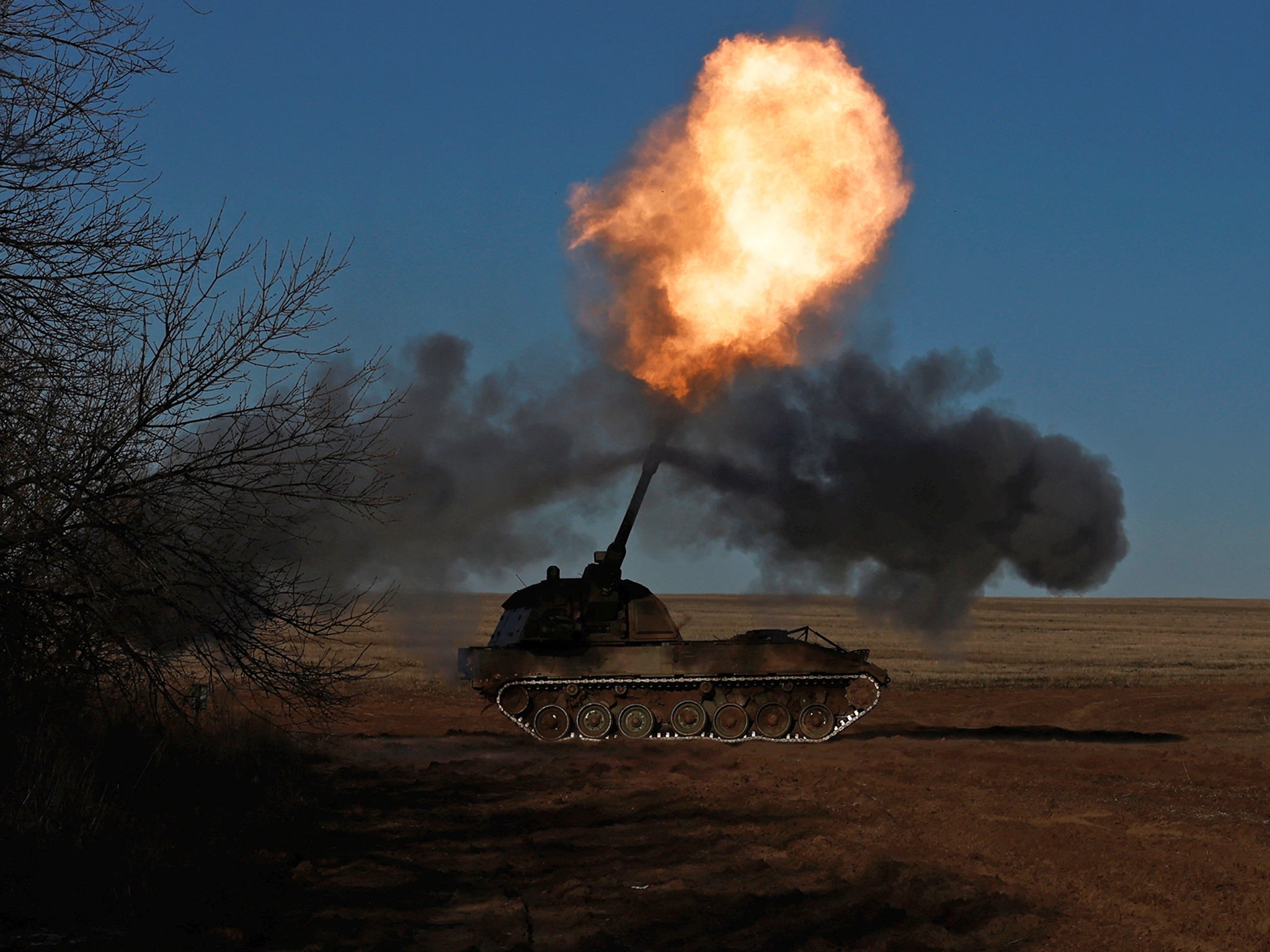 Members of the Ukrainian army’s 43rd Heavy Artillery Brigade fire from tanks near Soledar