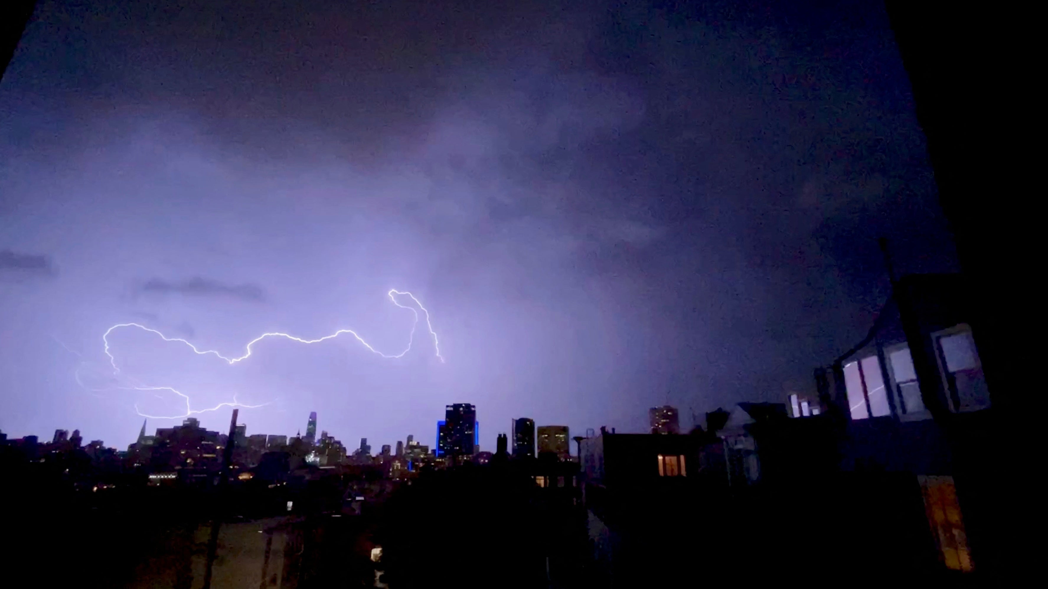 Lightning strikes are seen above buildings in San Fransisco, California on 5th January