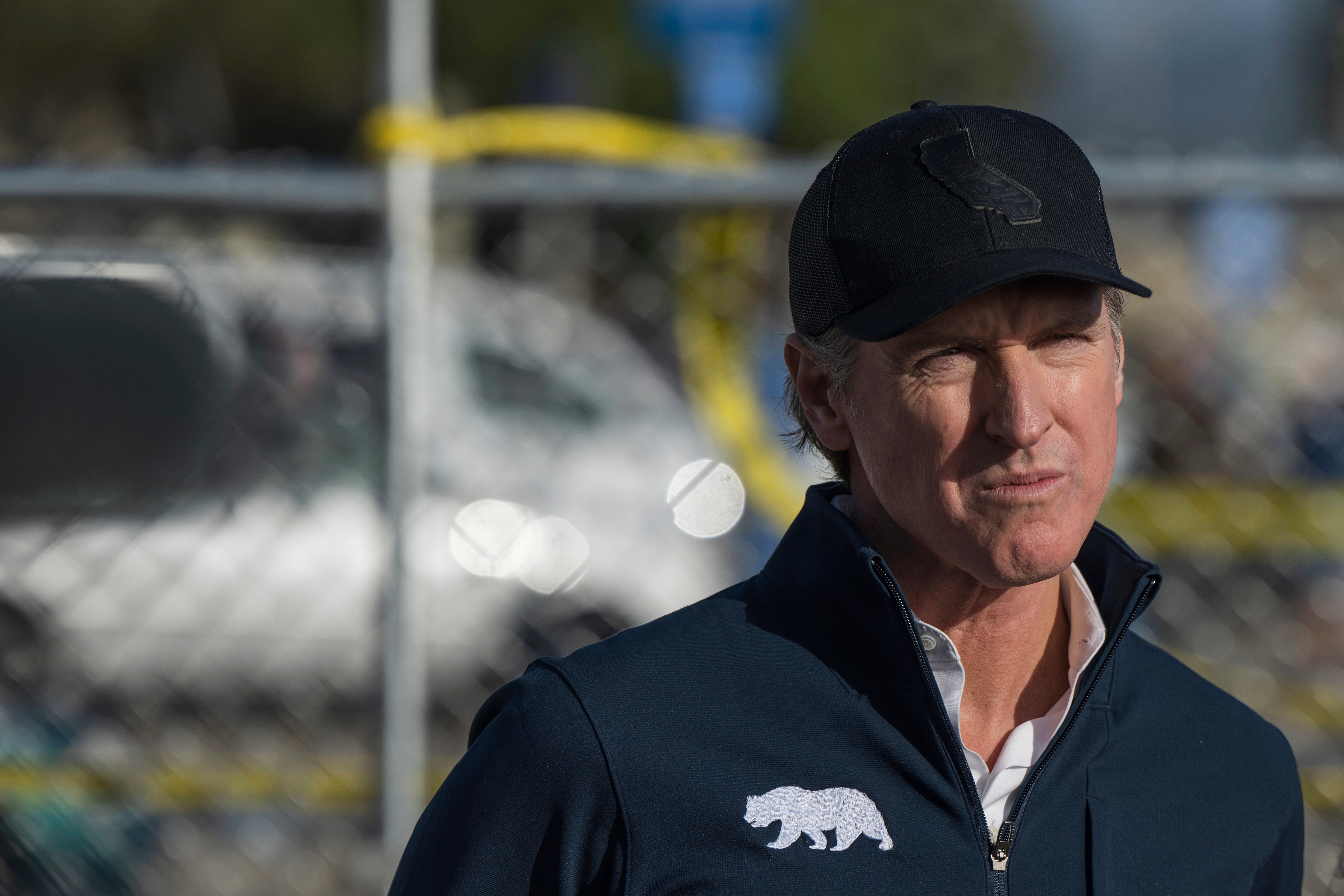 California Gov. Gavin Newsom listens during a news conference about storm damage on Jan. 10 in Capitola