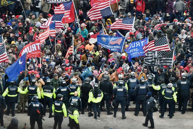 <p>Police and Trump supporters clash on January 6 </p>