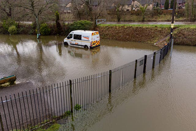 A van parked in water next to the River Taff in Taff’s Well, Wales (Ben Birchall/PA)