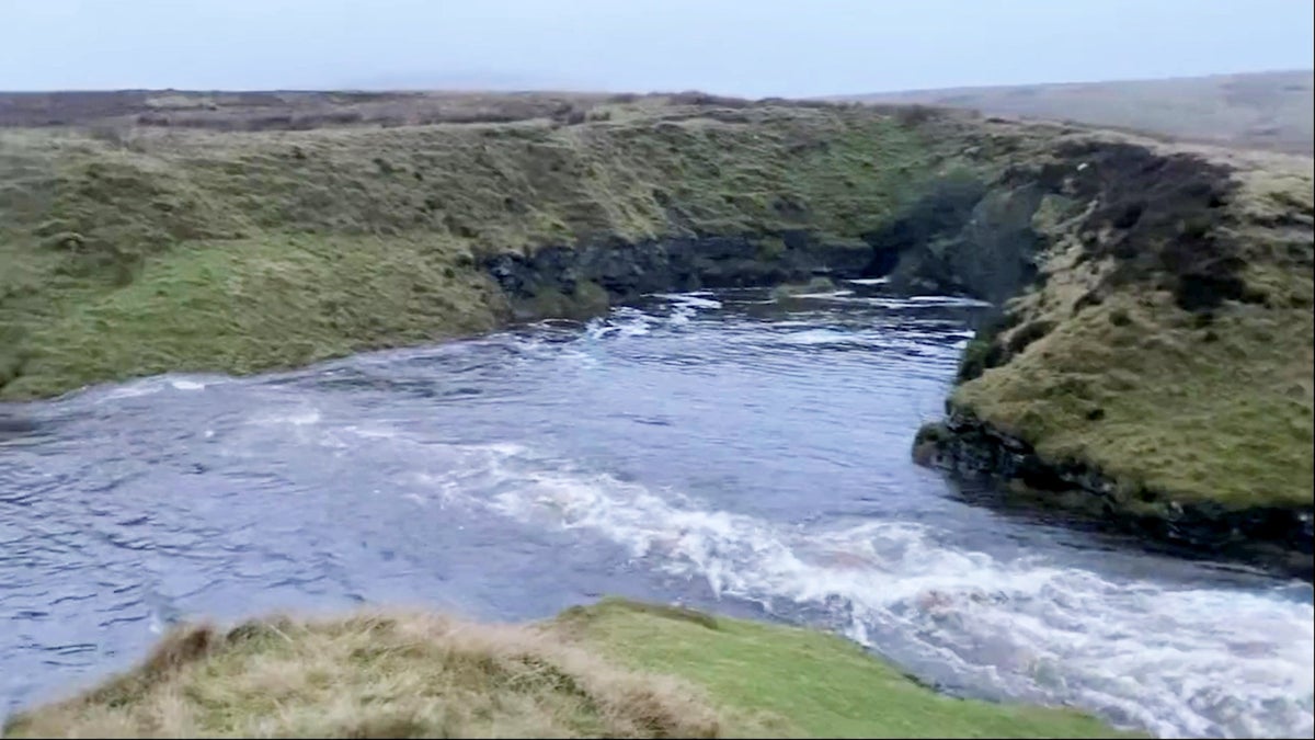 Heavy flooding turns 60ft waterfall into lake