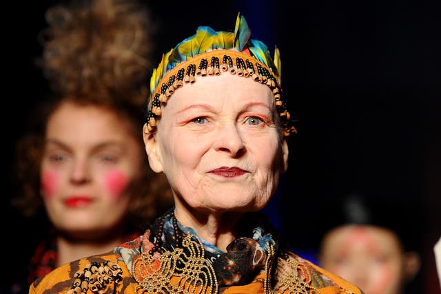 <p>Walking the runway during her autumn/winter show at Paris Fashion Week in March 2014</p>