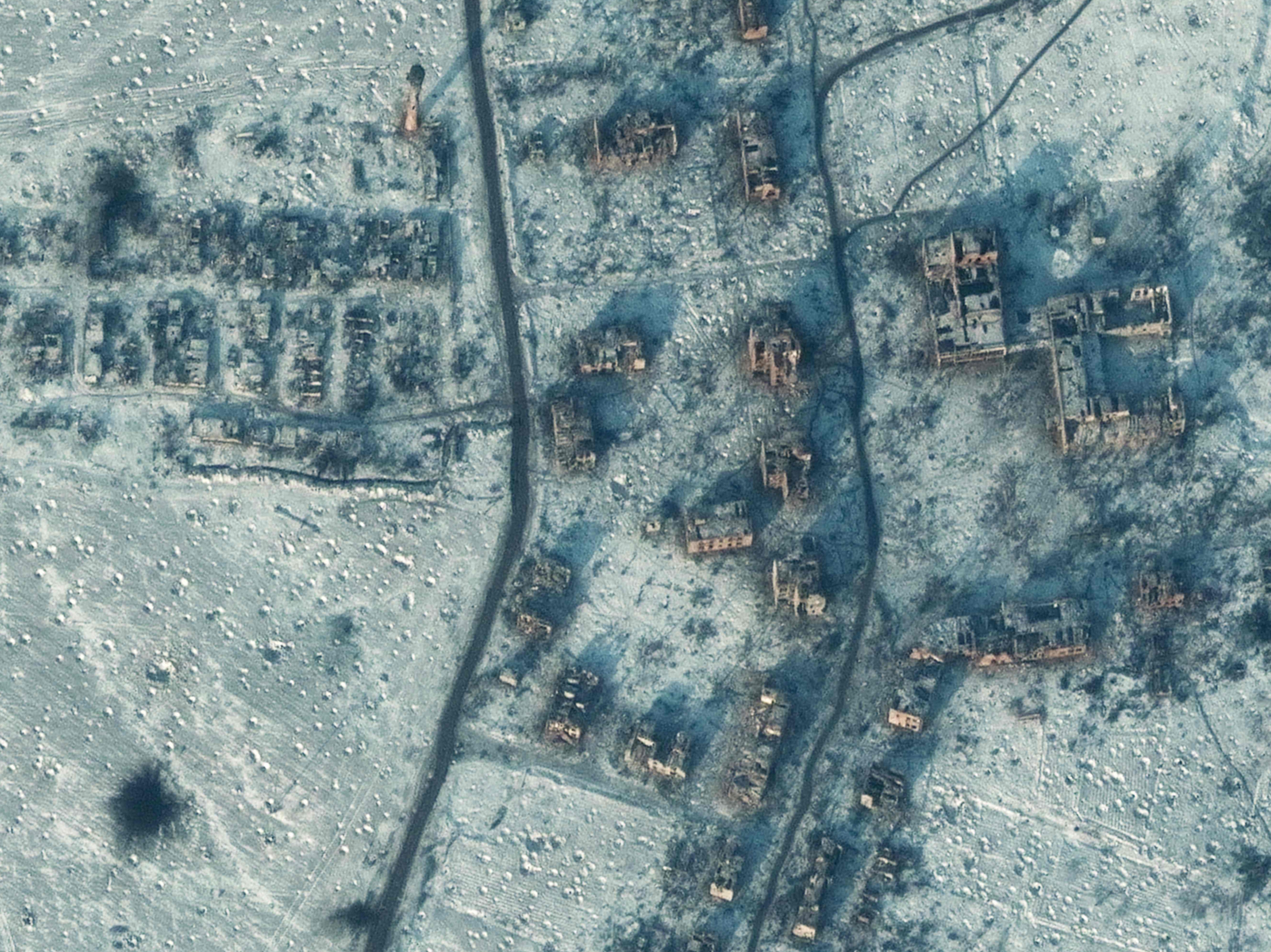Ruined buildings dot a bomb-scarred terrain in Soledar, in a satellite image taken on Tuesday