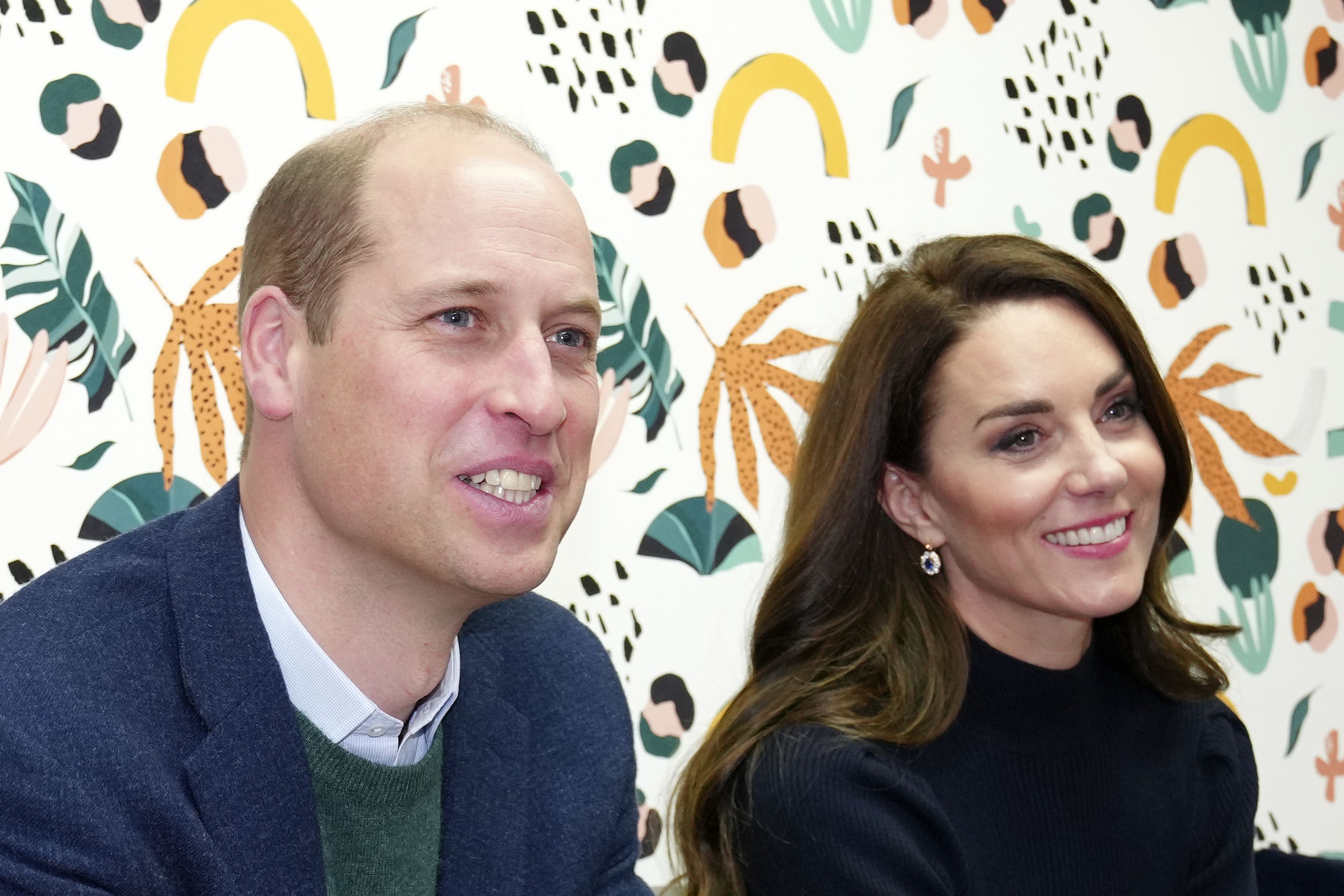 The Prince and Princess of Wales listen to young adults in the ‘Mentor Room’ during a visit to the Open Door mental health charity (Jon Super/PA)