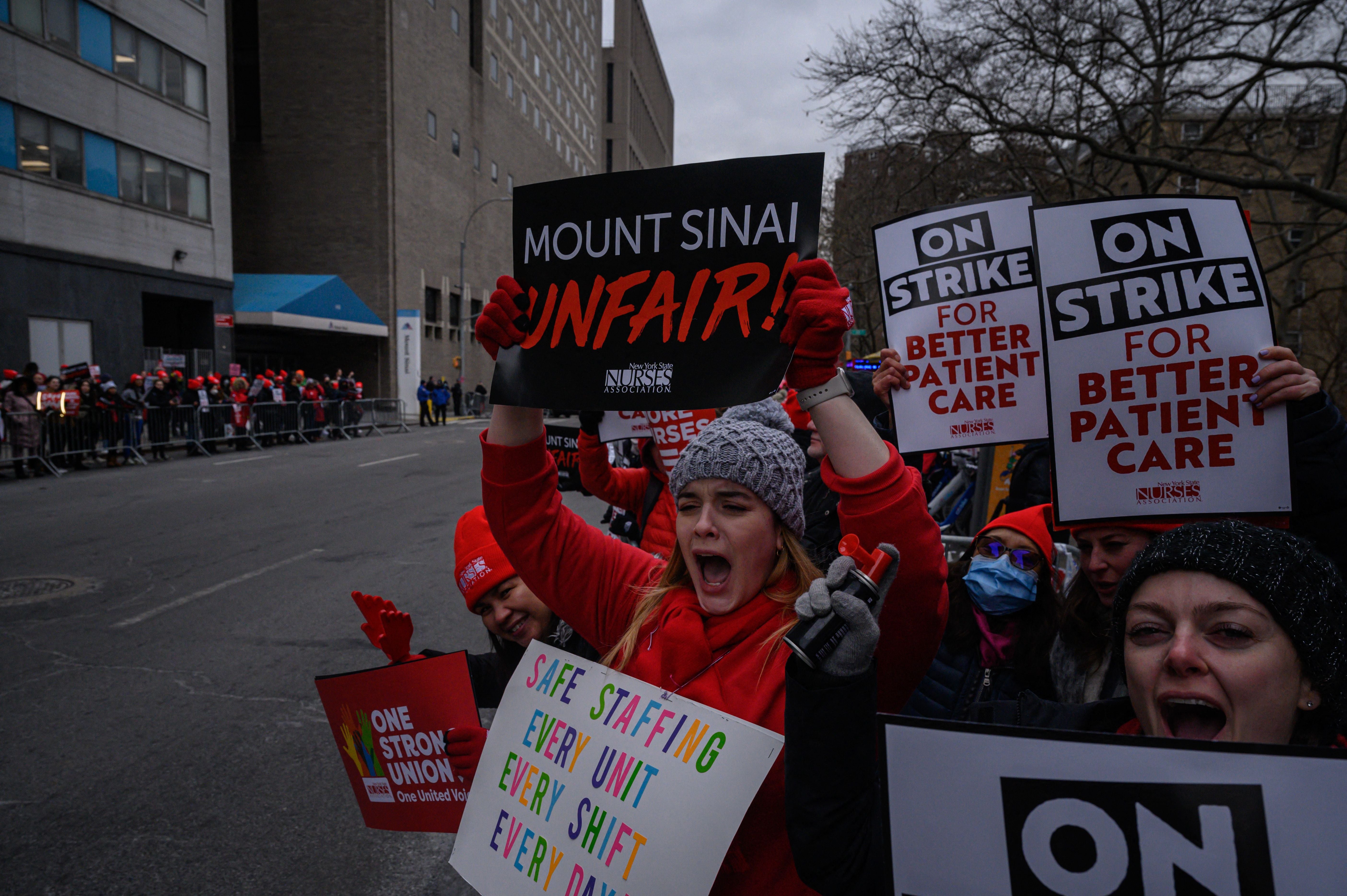 Nurses protest against low wages and staffing levels, during a strike outside the Mount Sinai hospital in New York