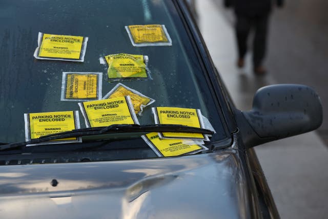 <p>Some readers said fines should go toward enforcing a pavement parking ban (Jonathan Brady/PA)</p>