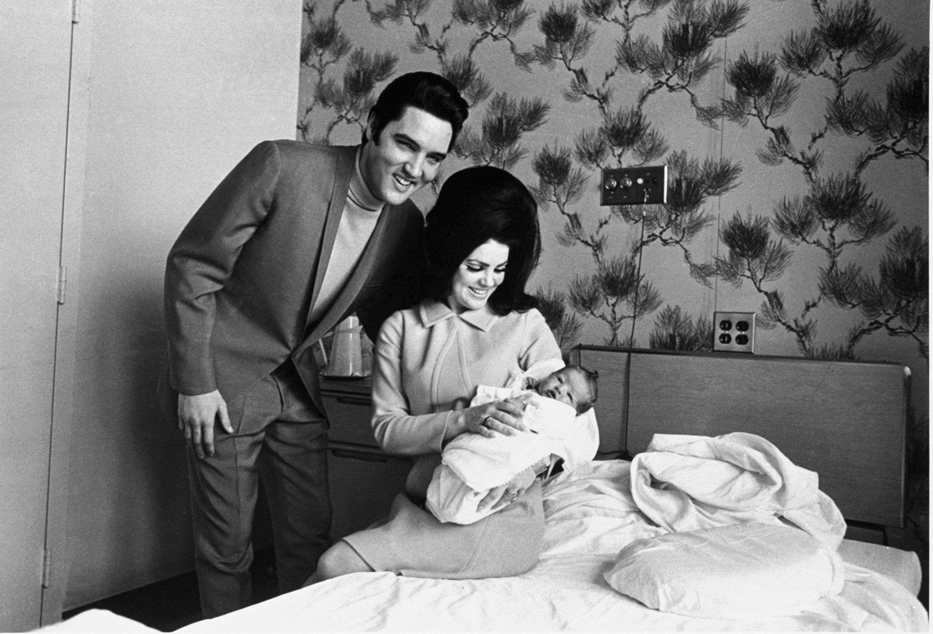 Newborn Lisa Marie Presley with parents Elvis and Priscilla