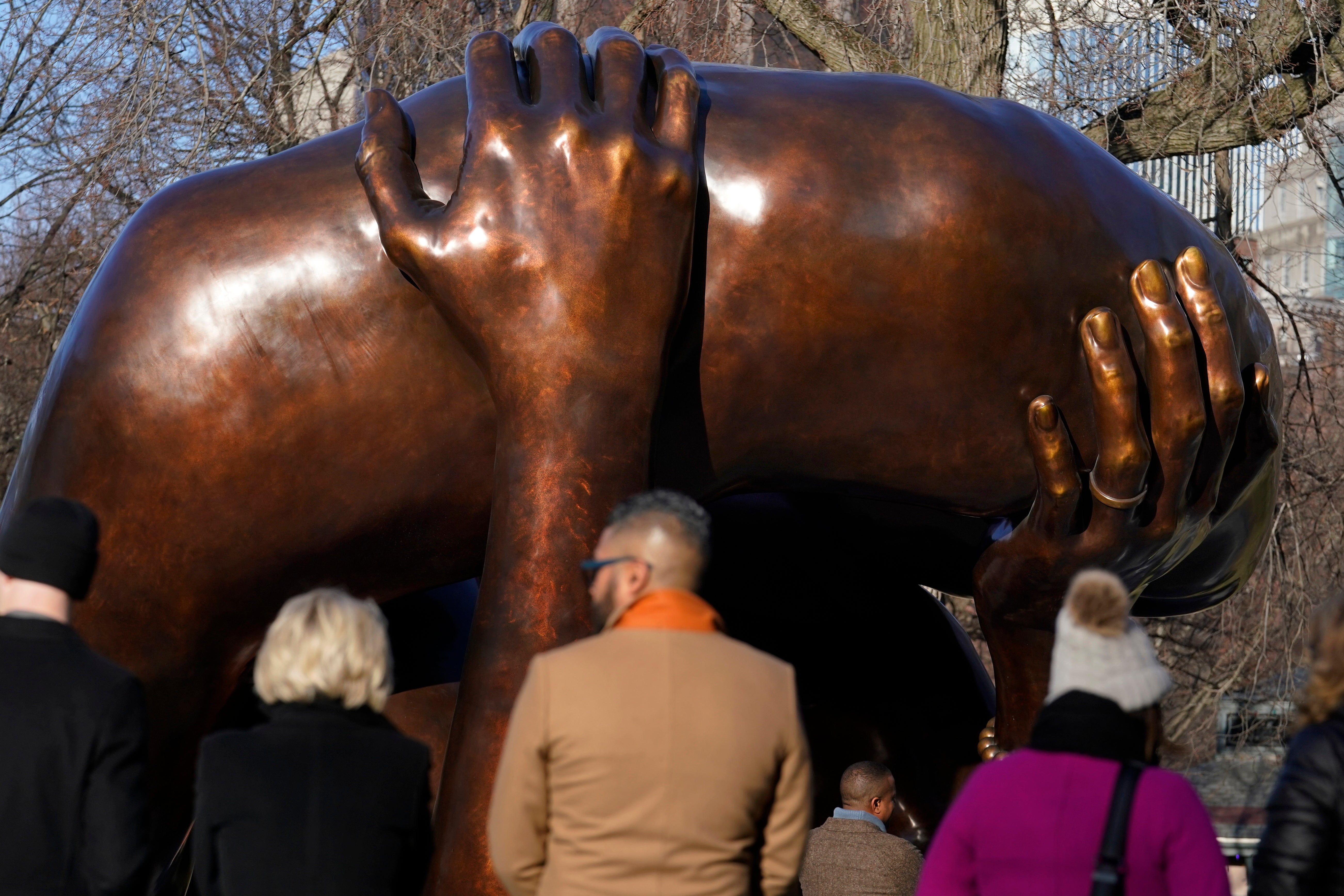 A 20-foot-high bronze sculpture ‘The Embrace,’ a memorial to Dr. Martin Luther King Jr. and Coretta King, has been derided online