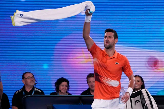 Novak Djokovic dances during his practice match against Nick Kyrgios (Mark Baker/AP)