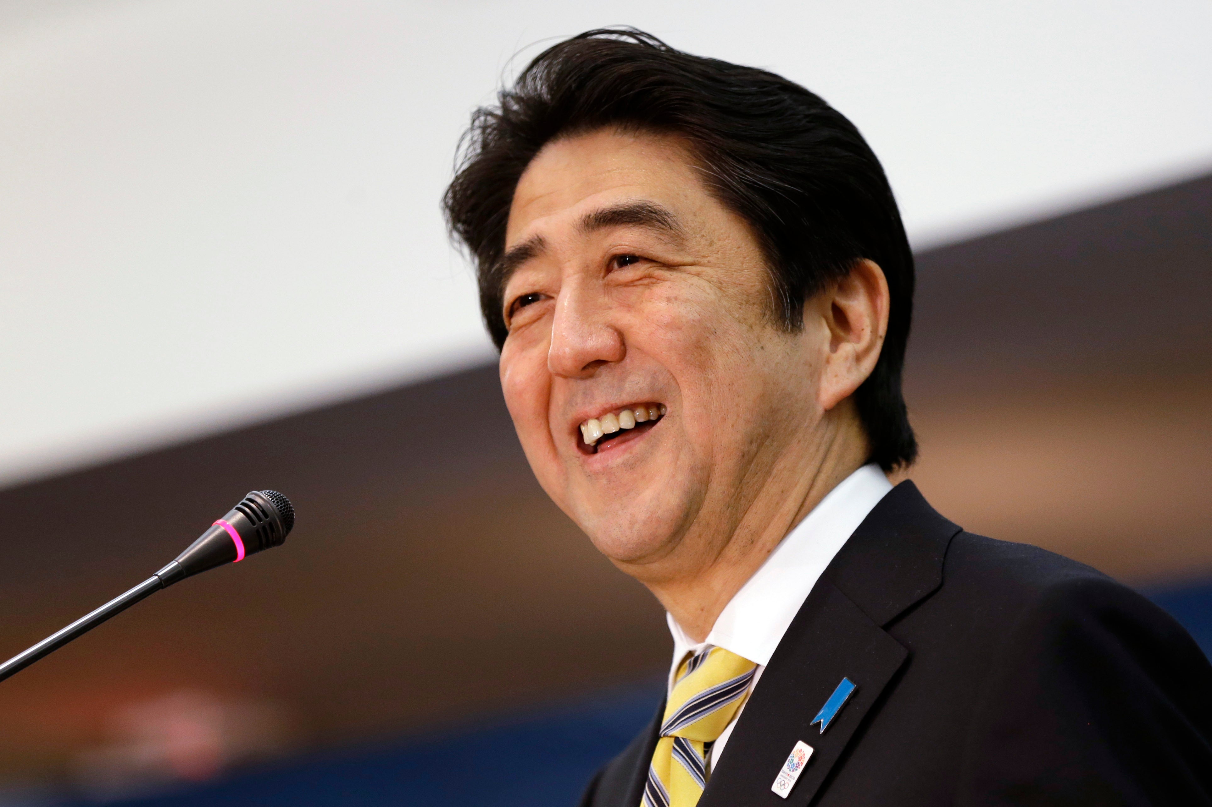 File Then-Japanese prime minister Shinzo Abe laughs while speaking at the Center for Strategic International Studies in Washington in 2013