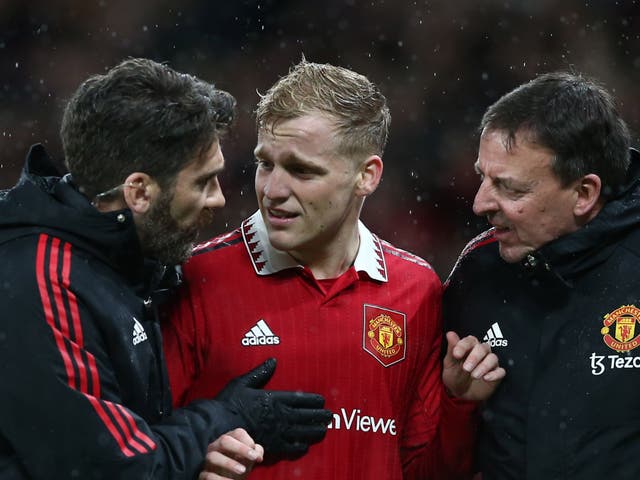 <p>Donny van de Beek of Manchester United reacts after picking up an injury</p>