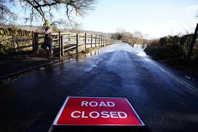 A bridge flooded by the River Avon, in Lacock, Wiltshire (Ben Birchall/PA)