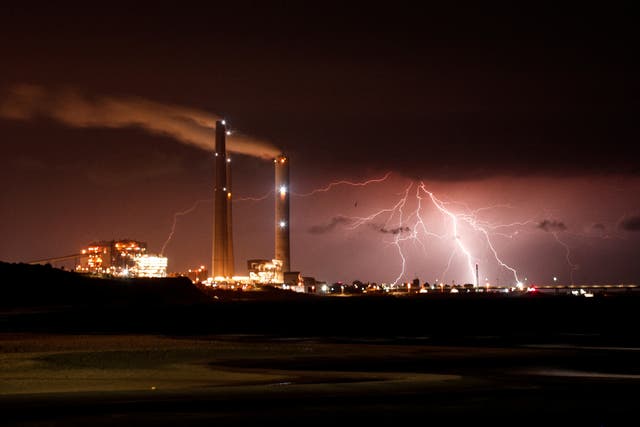 <p>Rutenberg power station is seen as lightning strikes over the Mediterranean sea at the coastal city of Ashkelon, Israel</p>