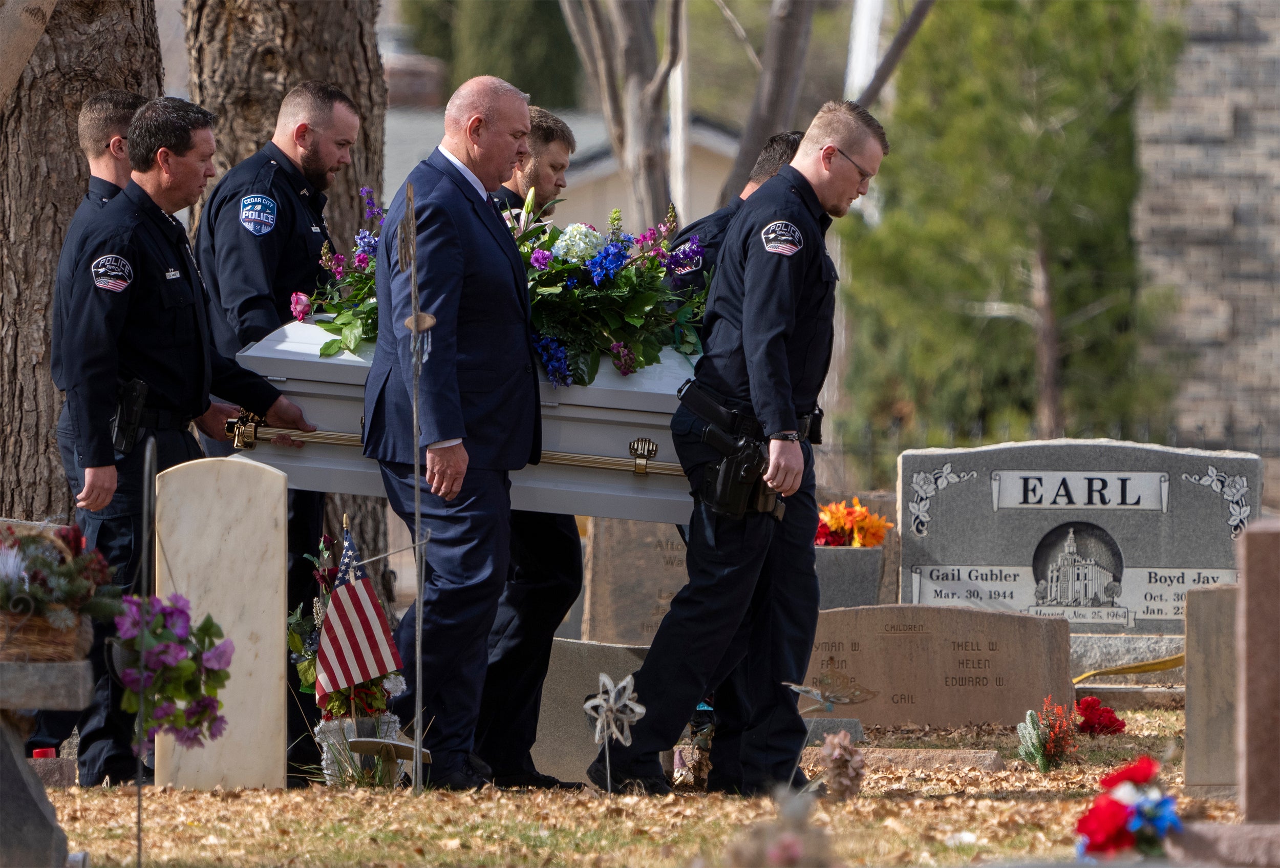 Pallbearers carry a casket to the graveside service for the Haight and Earl families in La Verkin, Utah